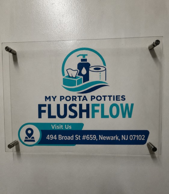 Acrylic office sign showing the My Porta Potties Flushflow logo and the address 494 Broad St #659