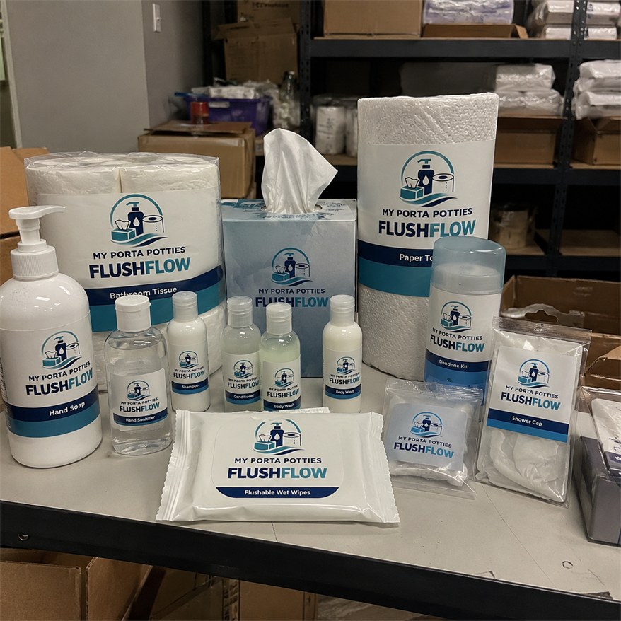 My Porta Potties Flushflow own-label hand soap, sanitizer, tissue, paper towels, wipes and travel-size bottles on the counter